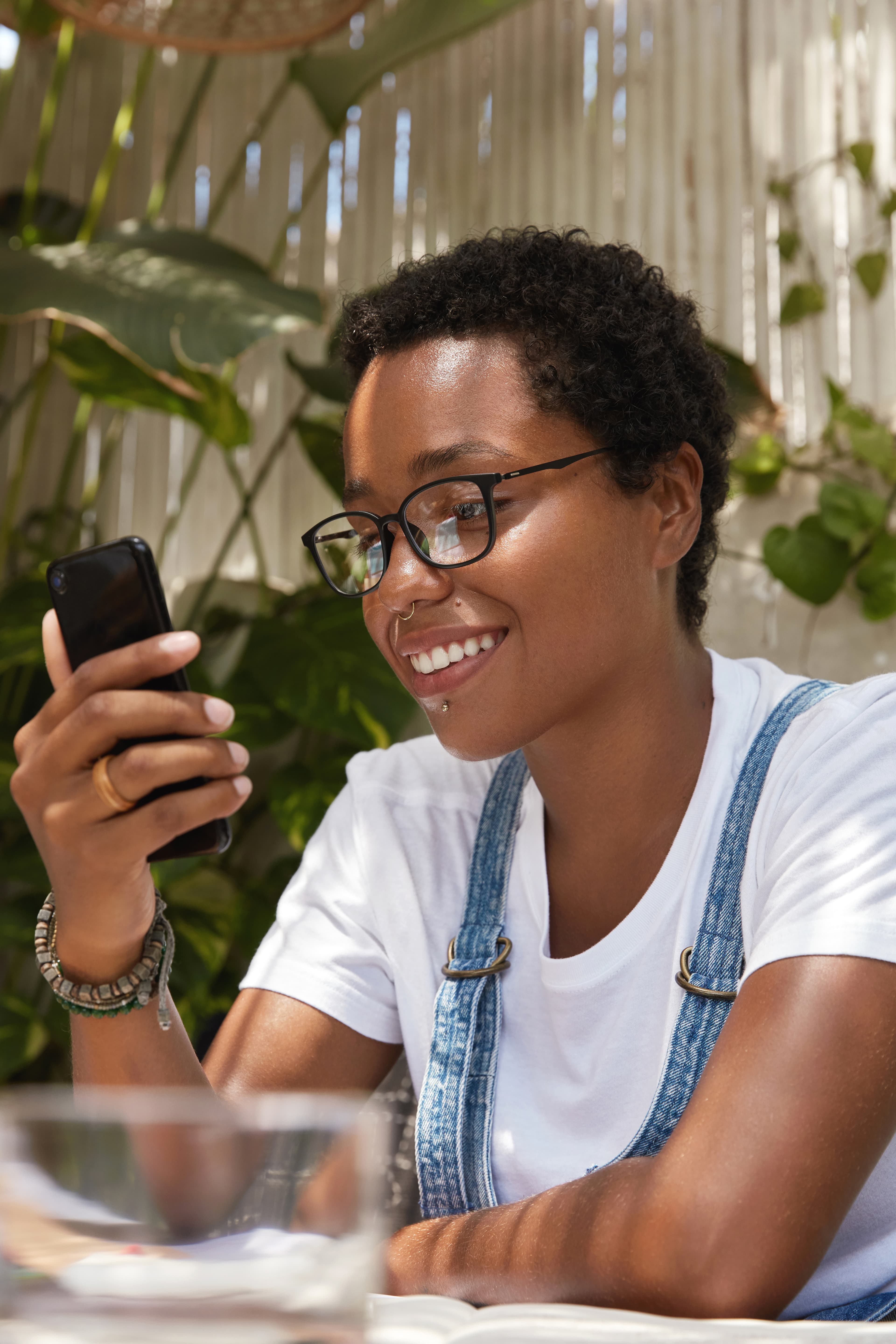 Person smiling while using their phone
